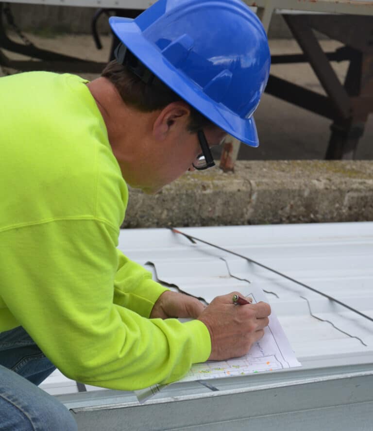 CBC Construction worker going over blueprints