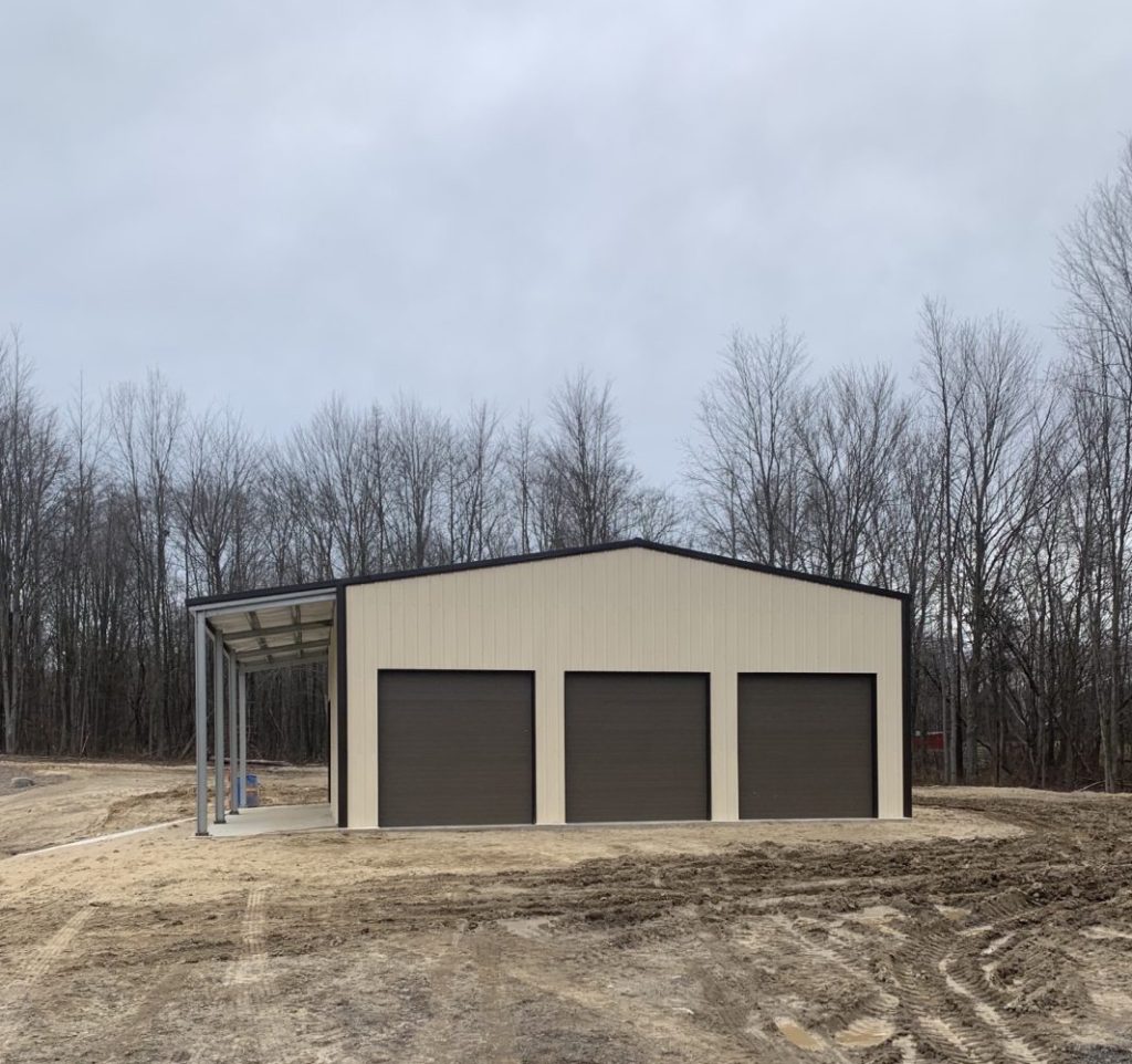 side view with three garage doors